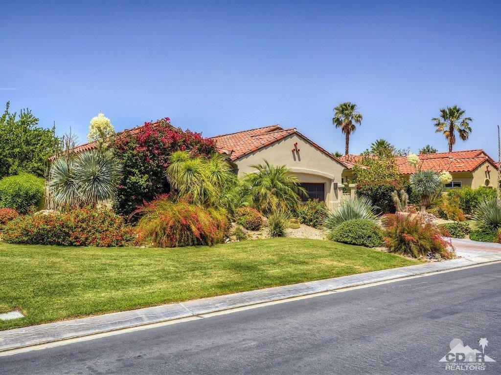 285 Loch Lomond Road Rancho Mirage, CA 92270 - Photo 45 of 48 a front view of a house with a yard