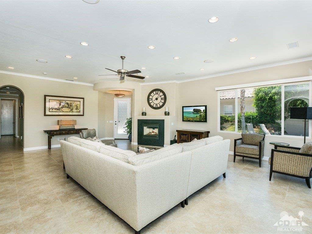 285 Loch Lomond Road Rancho Mirage, CA 92270 - Photo 6 of 48 a living room with furniture and a large window