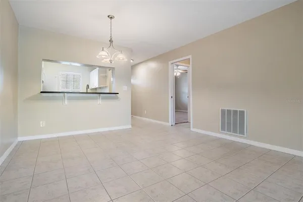 a view of a kitchen with granite countertop cabinets