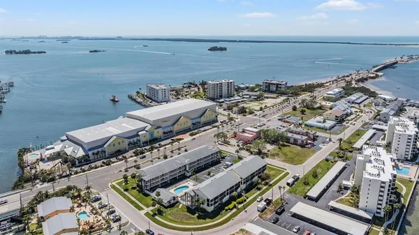 an aerial view of a house with a ocean view