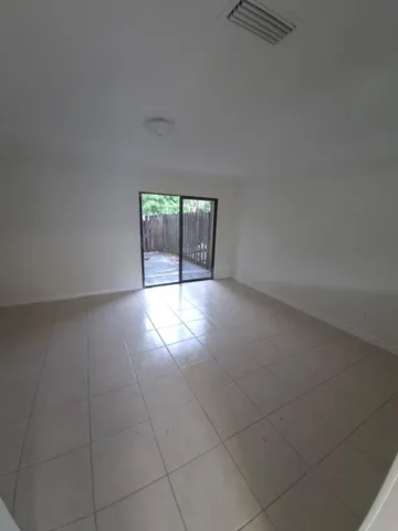 a view of an empty room with windows