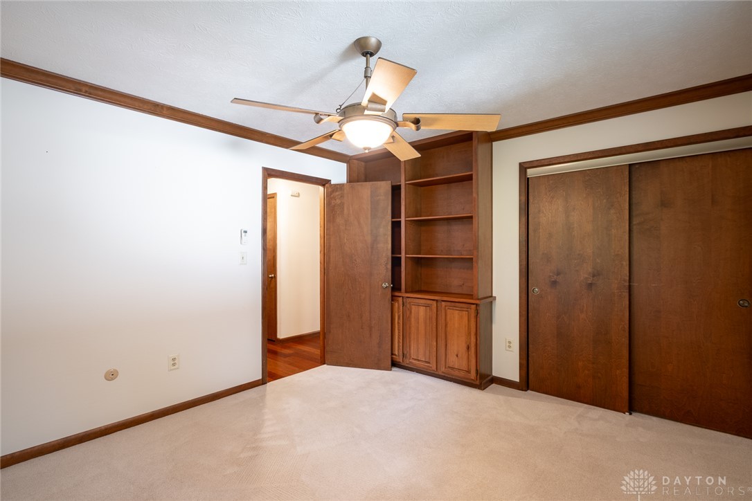 273 North Alpha Bellbrook Road Dayton, OH 45434 - Photo 31 of 43 A well-appointed bedroom featuring classic wood trim and built-in shelving.