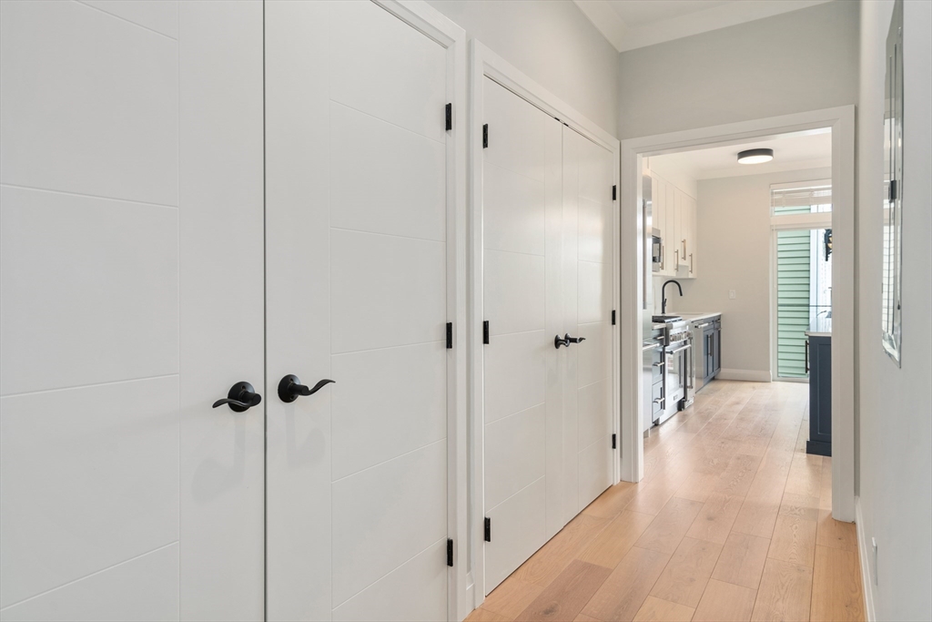 142 Pleasant Street Boston, MA 02125 - Photo 14 of 24 a view of a bathroom with a glass door shower