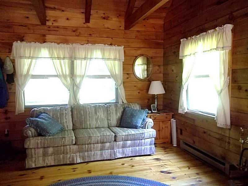 176 Stephens Road Oquossoc, ME 04964 - Photo 5 of 30 Living Room. Front living room