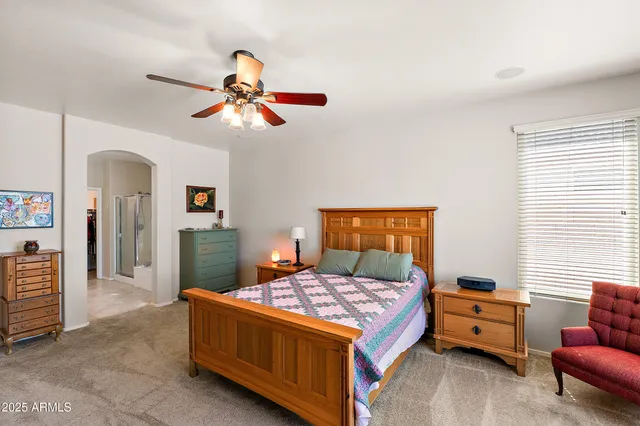 a bedroom with a bed and furniture