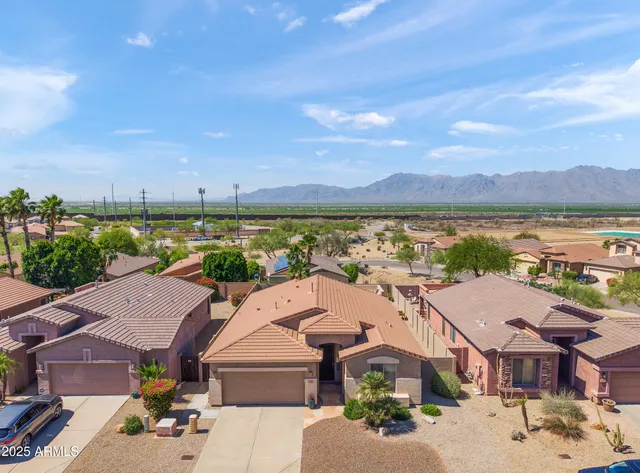 an aerial view of a house with a lake view