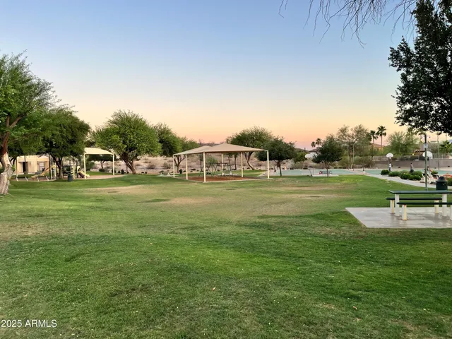 a view of a park with swings and slides