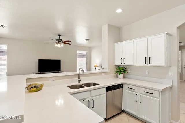 a kitchen with a sink and a refrigerator