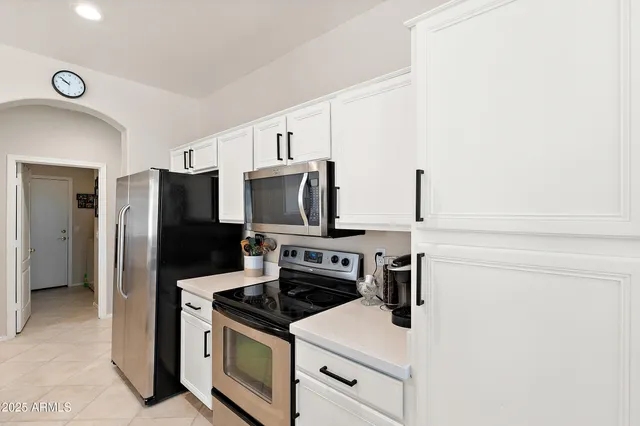 a kitchen with a stove microwave and refrigerator