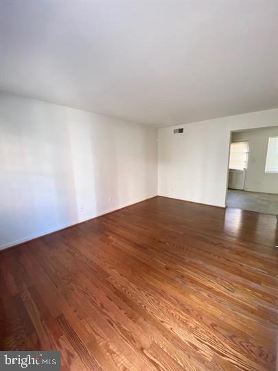 1103 Prince Edward Street, Unit 3 Fredericksburg, VA 22401 - Photo 5 of 9 a view of empty room with wooden floor