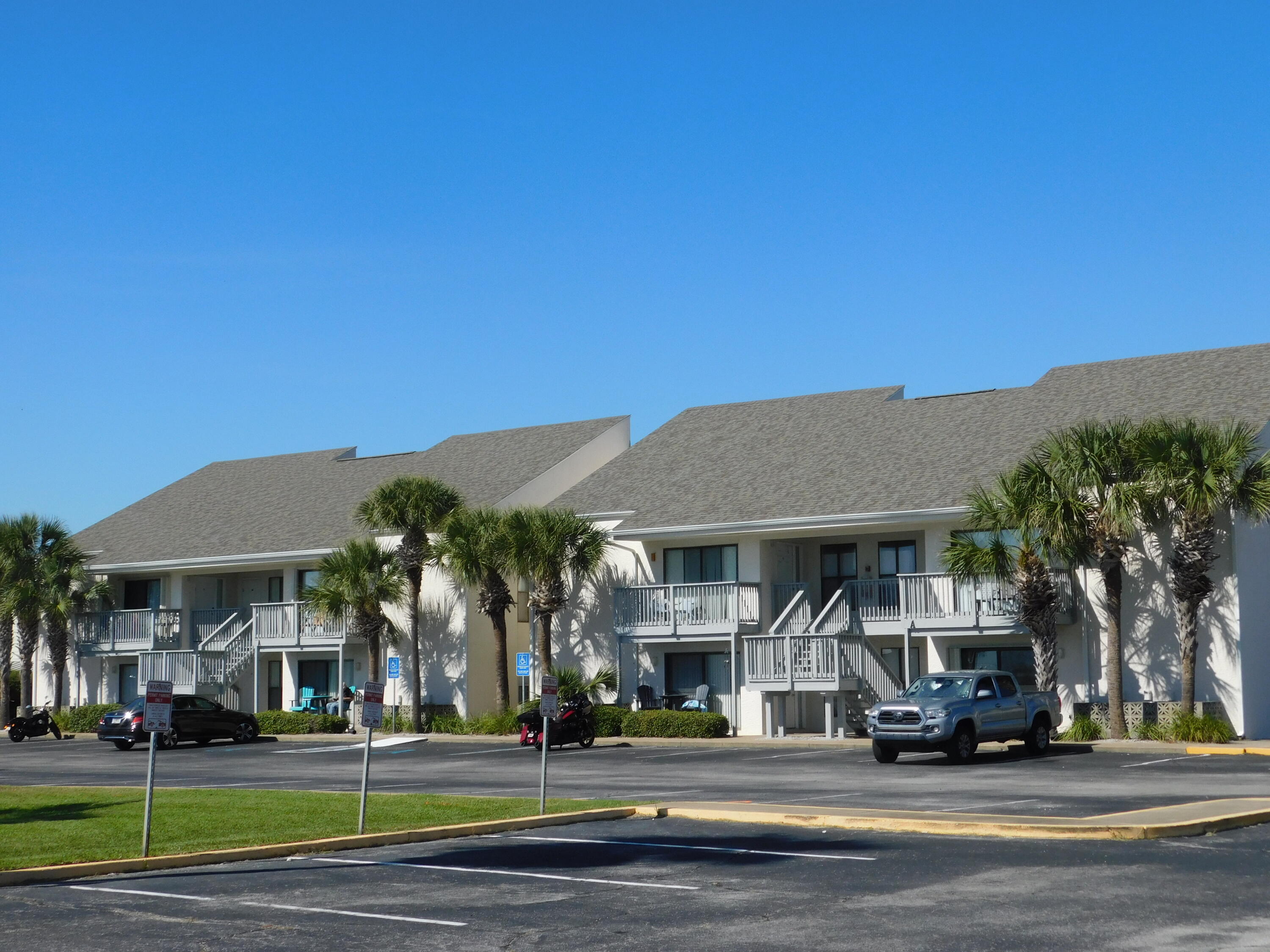 17614 Front Beach Road, Unit A38 Panama City Beach, FL 32413 - Photo 22 of 22 a view of a food mall next to a road