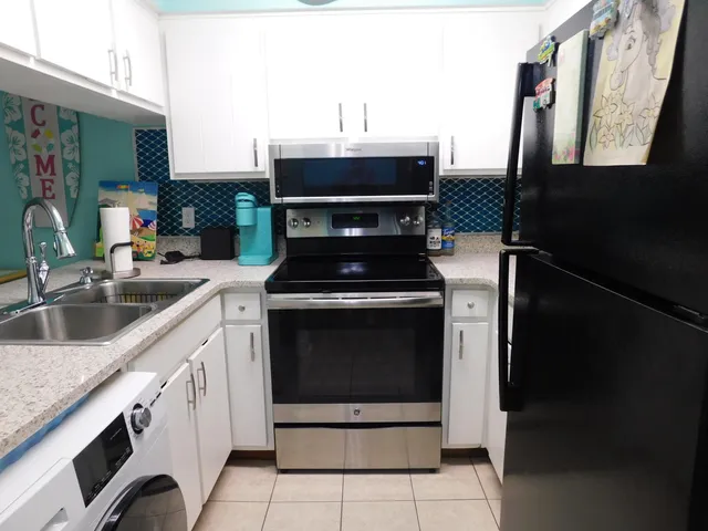a kitchen with a stove and a sink