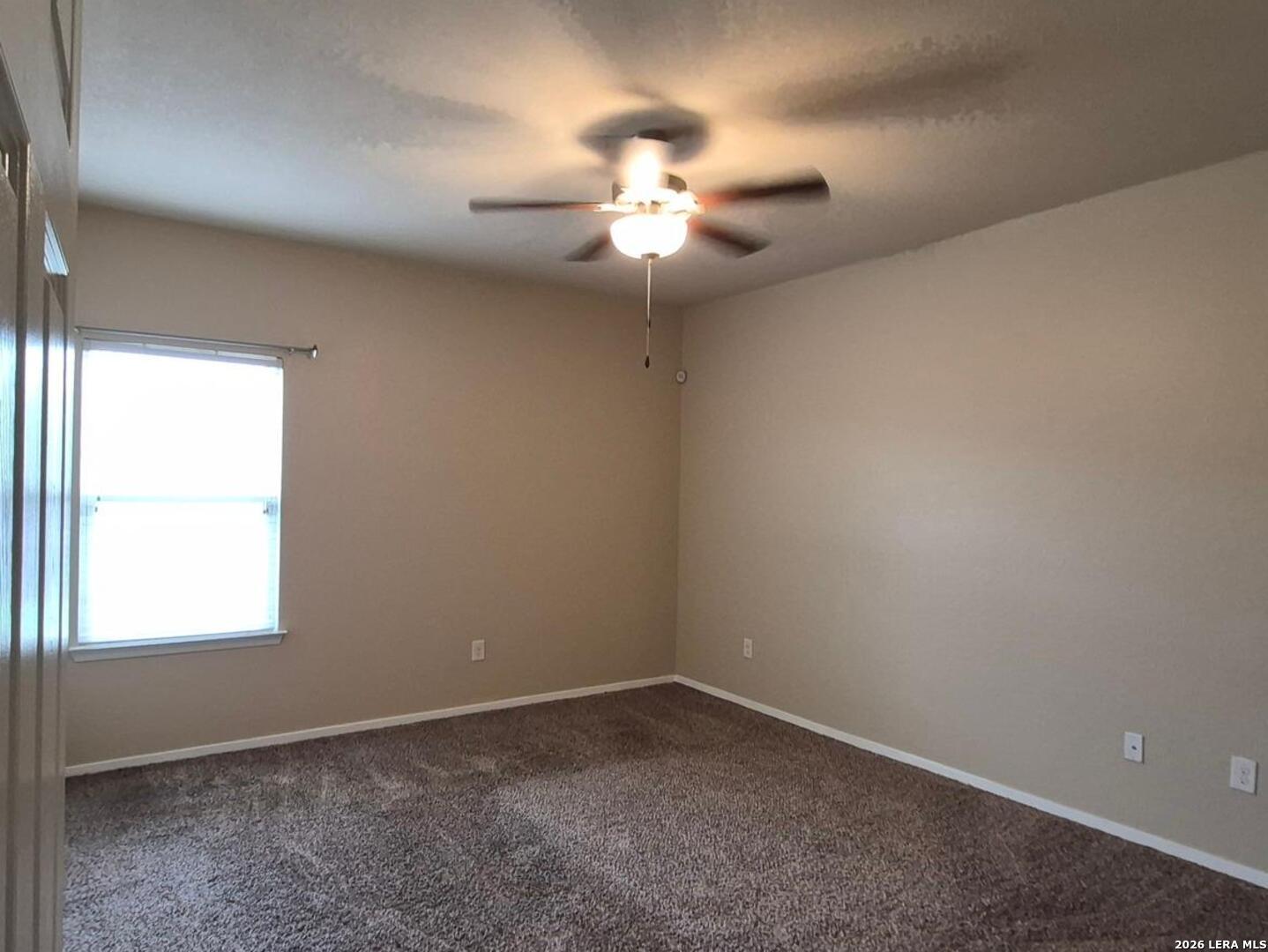 7102 Zuma Beach Converse, TX 78109 - Photo 15 of 31 an empty room with a window and a fan