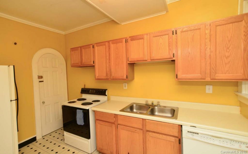 1237 Romany Road Charlotte, NC 28203 - Photo 11 of 15 a kitchen with a sink cabinets and appliances