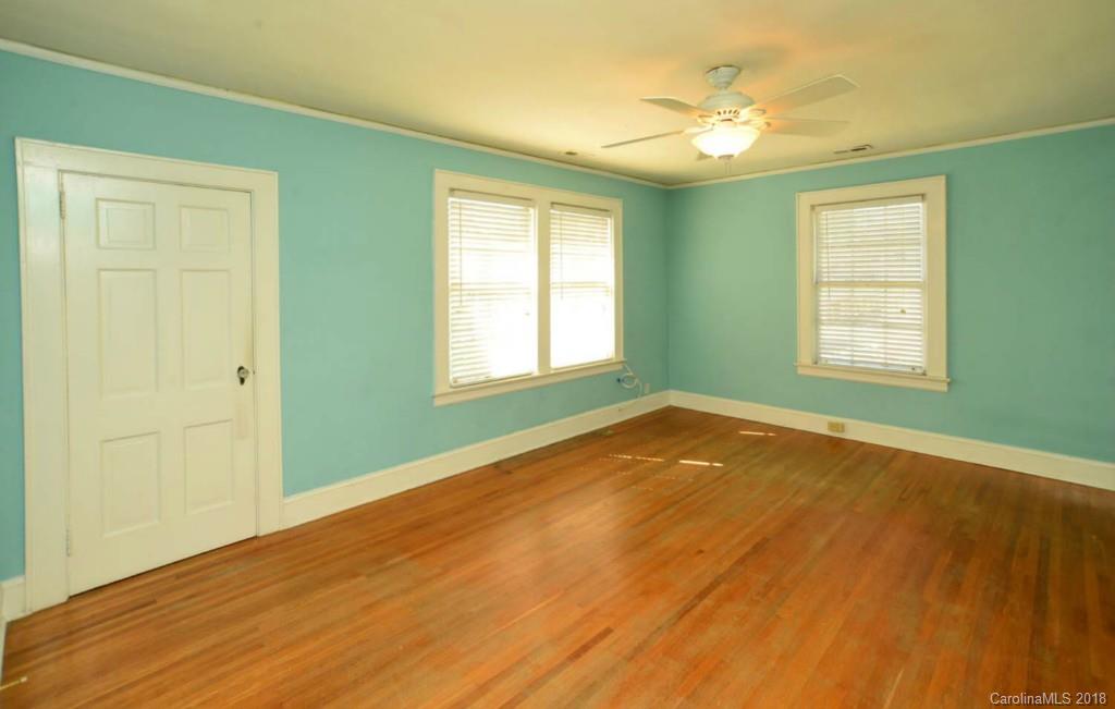 1237 Romany Road Charlotte, NC 28203 - Photo 13 of 15 a view of an empty room with window and wooden floor