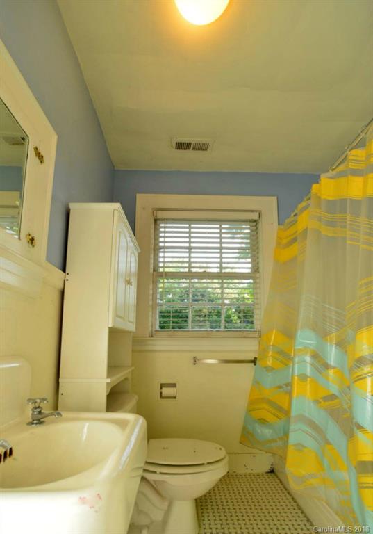 1237 Romany Road Charlotte, NC 28203 - Photo 15 of 15 a bathroom with a sink and a mirror