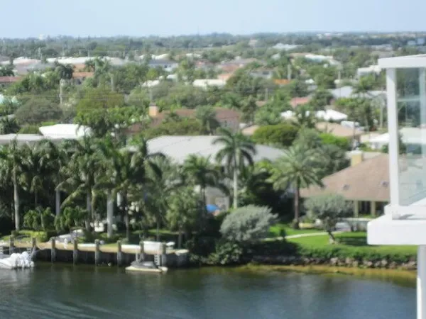 a view of residential houses with outdoor space and lake view