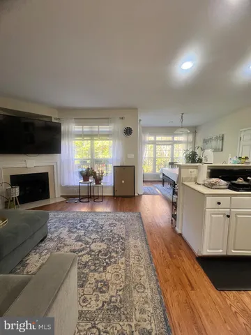 a large white kitchen with cabinets