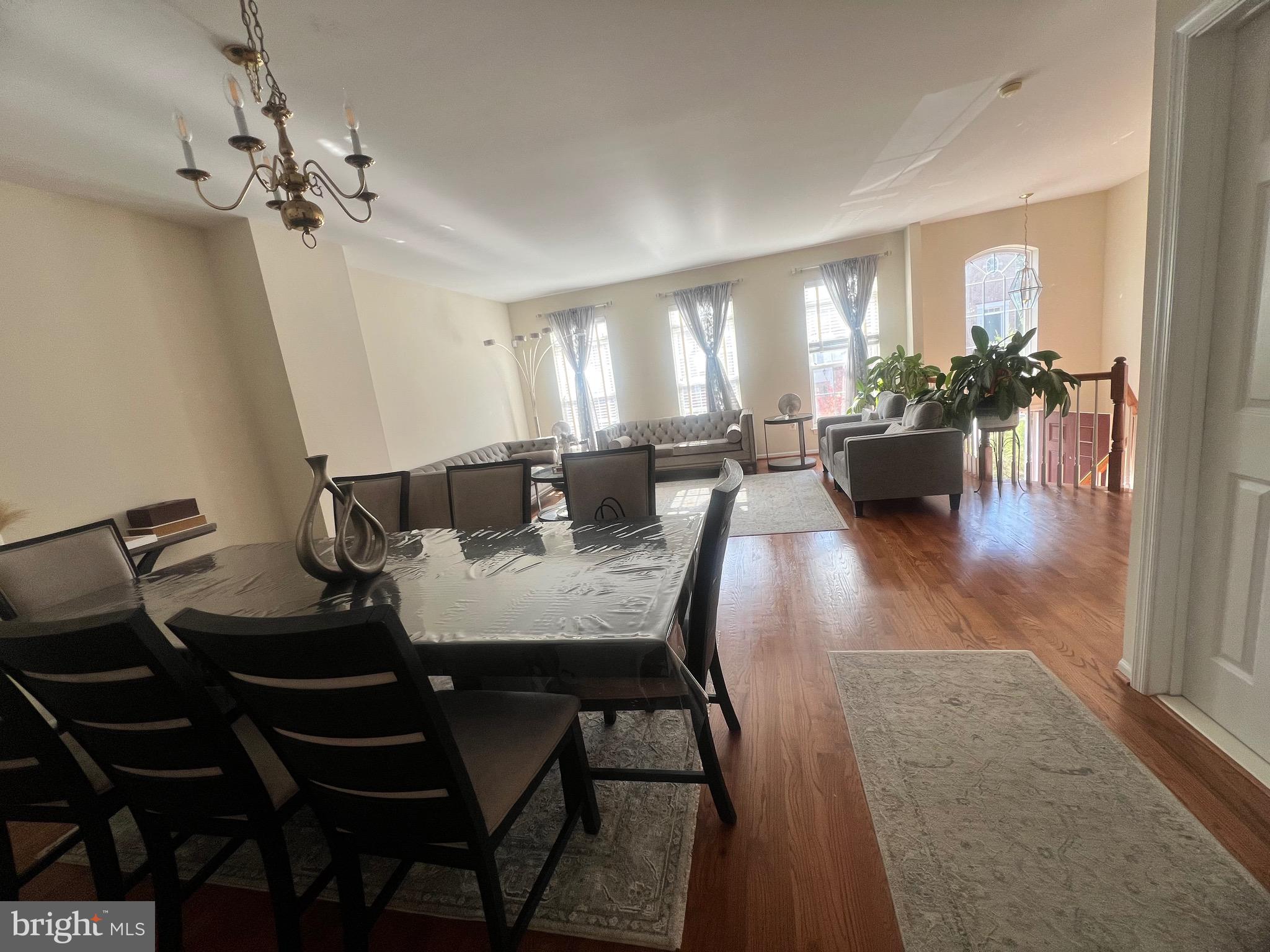 7317 Hampton Manor Place Springfield, VA 22150 - Photo 2 of 38 a view of a dining room with furniture and wooden floor