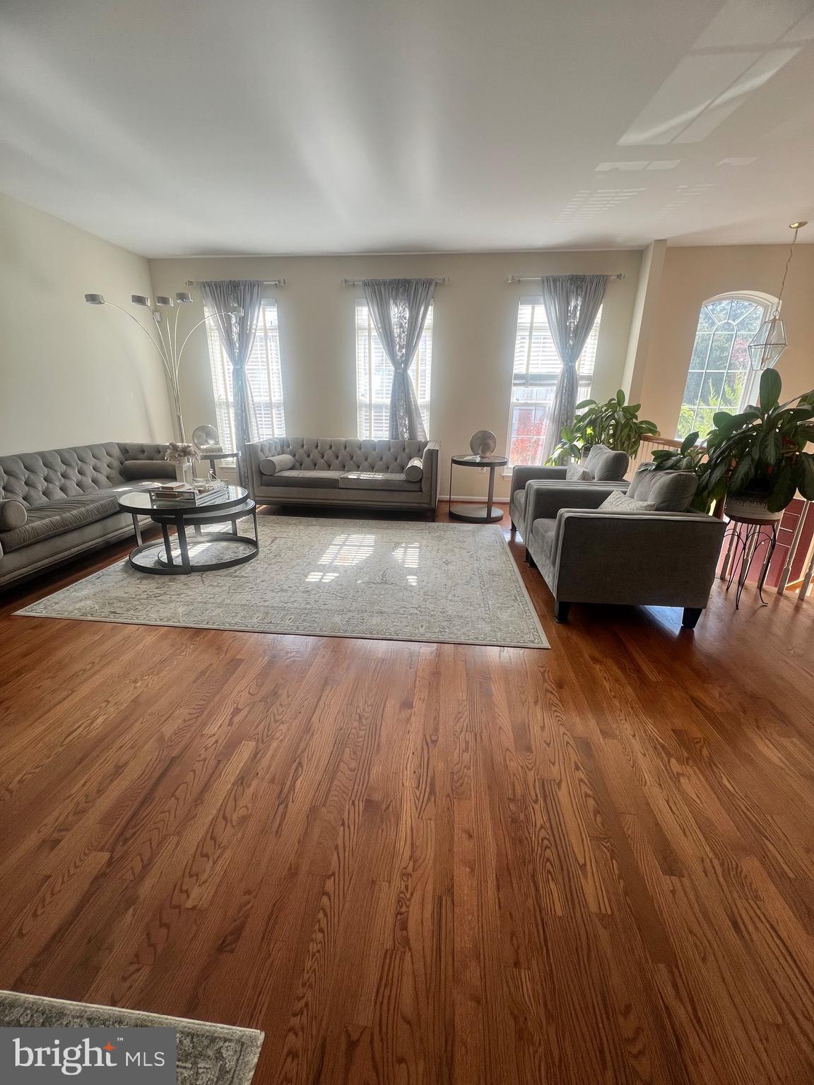 7317 Hampton Manor Place Springfield, VA 22150 - Photo 3 of 38 a living room with furniture and a wooden floor