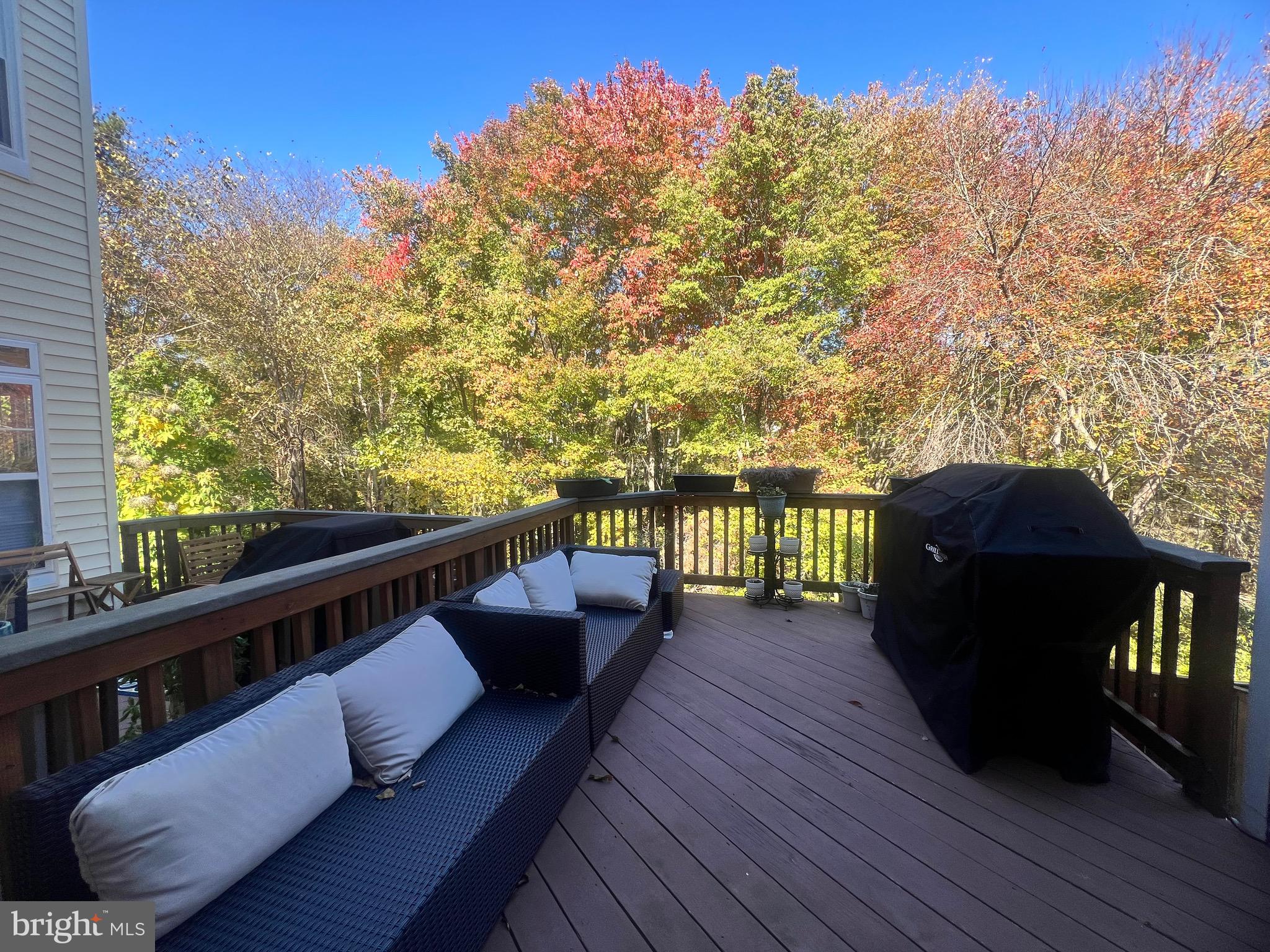 7317 Hampton Manor Place Springfield, VA 22150 - Photo 34 of 38 a balcony with wooden floor and outdoor seating