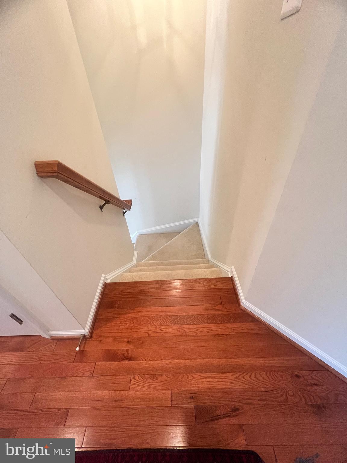7317 Hampton Manor Place Springfield, VA 22150 - Photo 7 of 38 a view of empty room with wooden floor