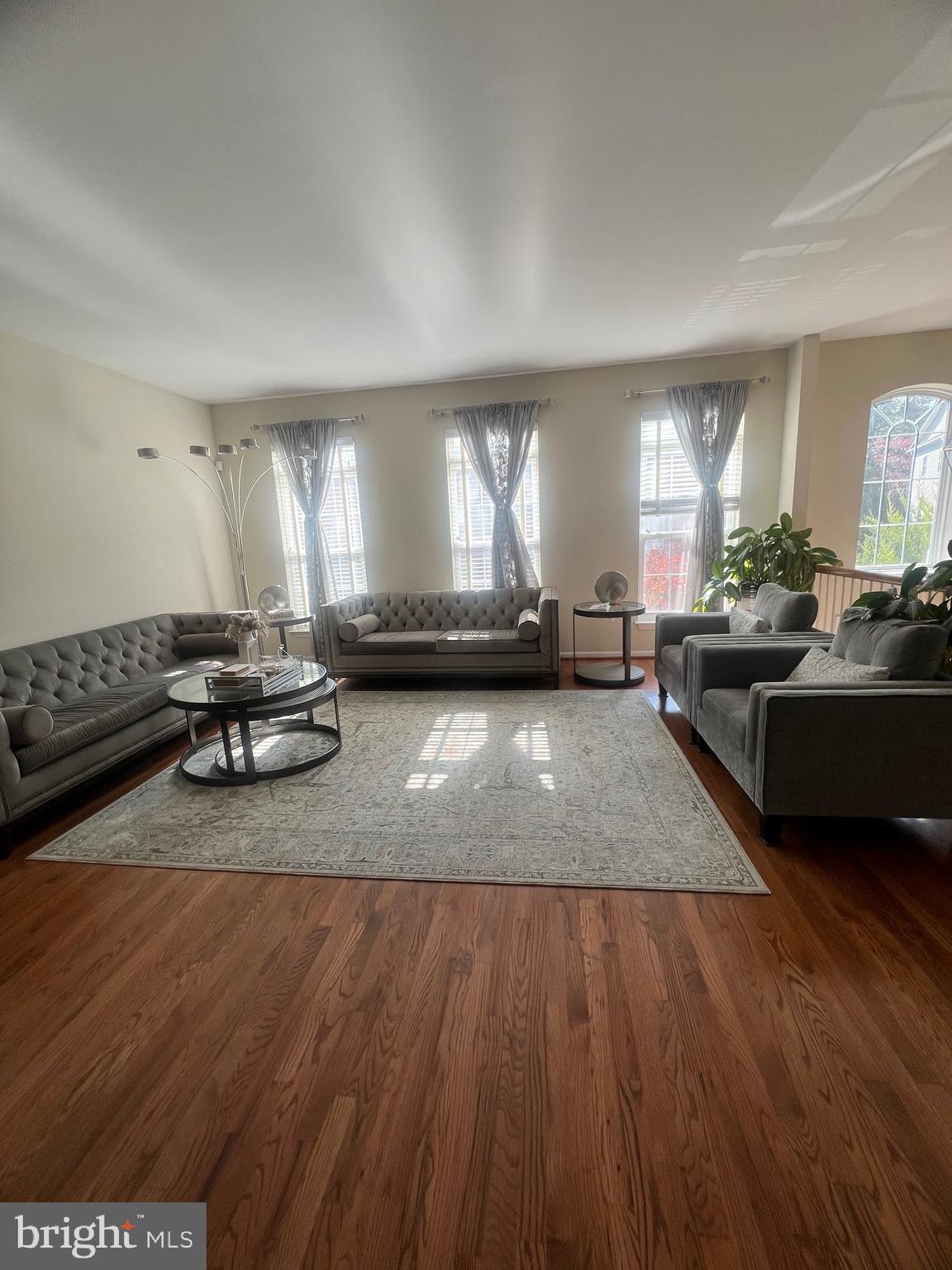 7317 Hampton Manor Place Springfield, VA 22150 - Photo 8 of 38 a living room with furniture and a large window
