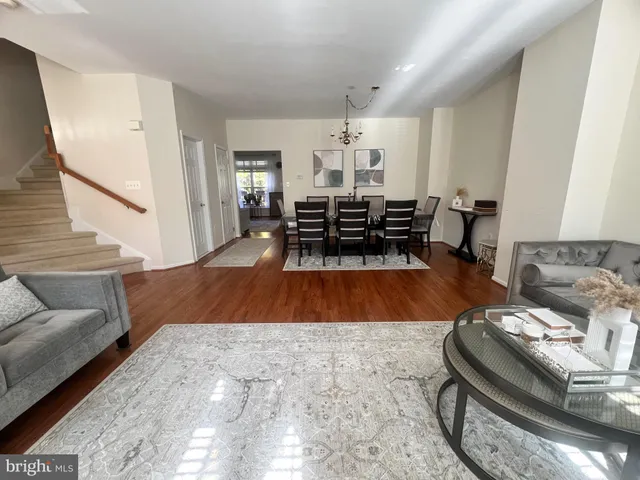 a living room with furniture and white walls