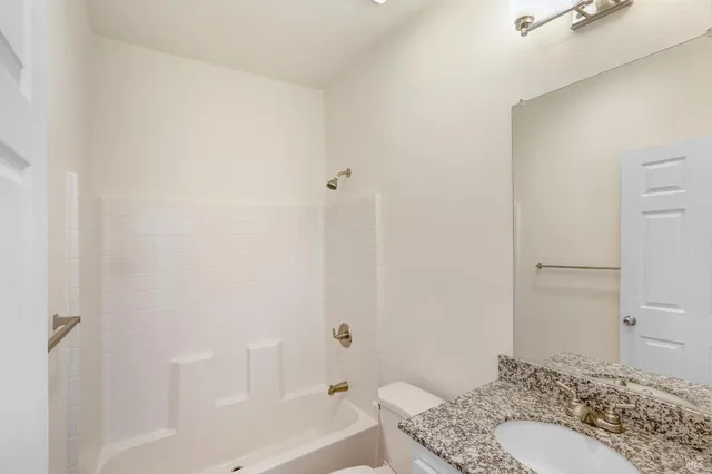 a kitchen with lots of counter top space and wooden floor