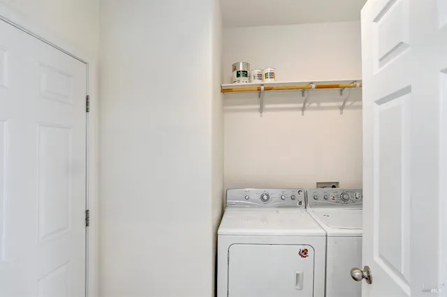 a bedroom with a bed and a table