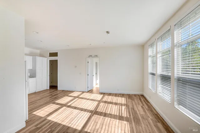 a kitchen with refrigerator and window