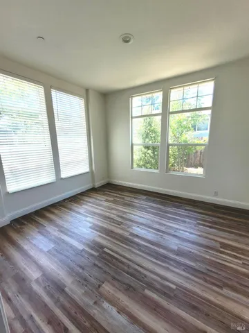 a bathroom with a granite countertop sink a mirror and a bathtub