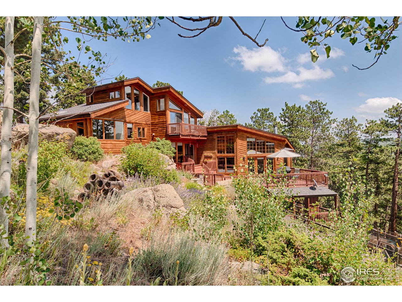 3464 Ridge Road Nederland, CO 80466 - Photo 28 of 35 a front view of a house with a yard
