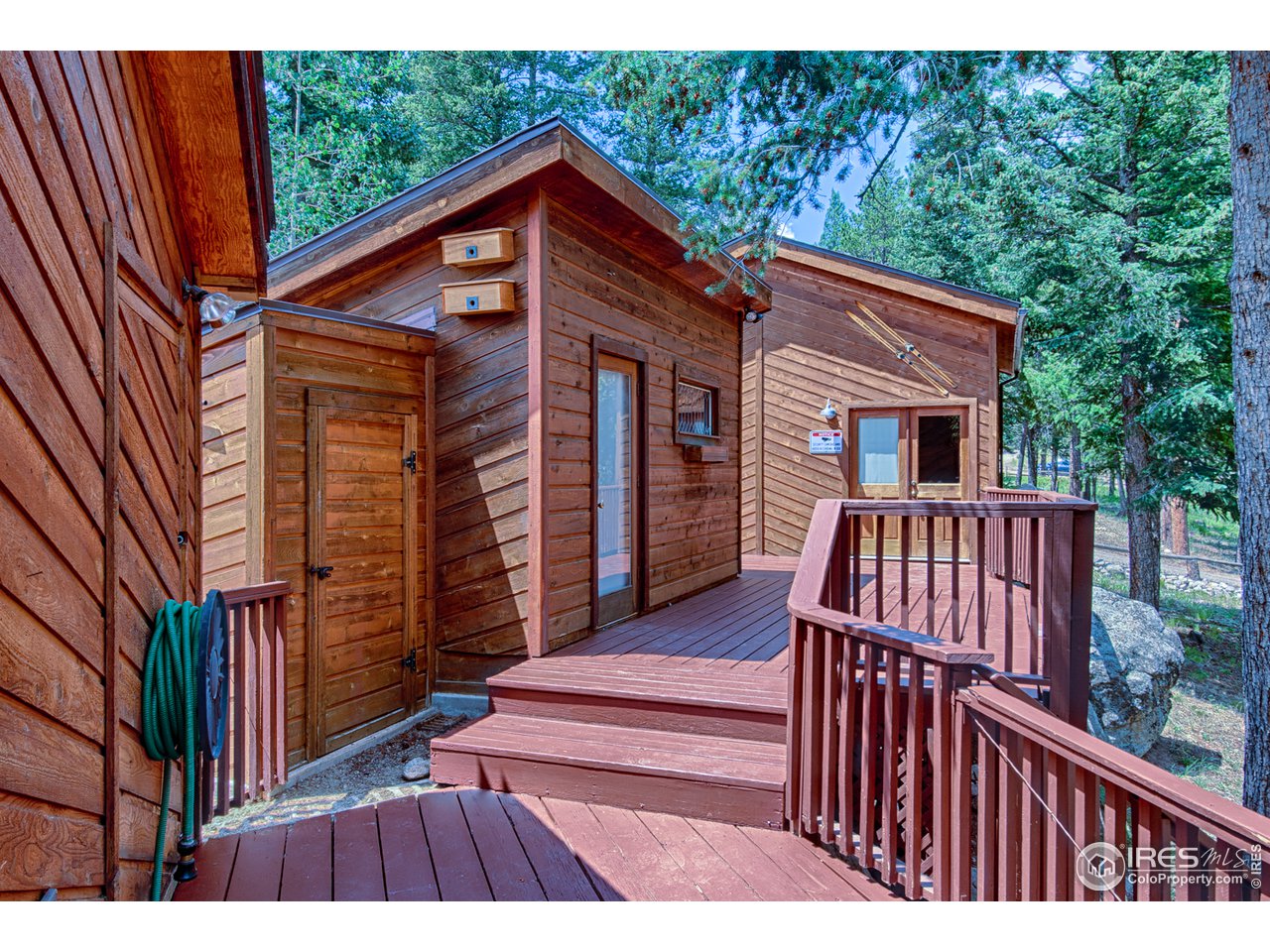 3464 Ridge Road Nederland, CO 80466 - Photo 32 of 35 a view of a house with wooden deck