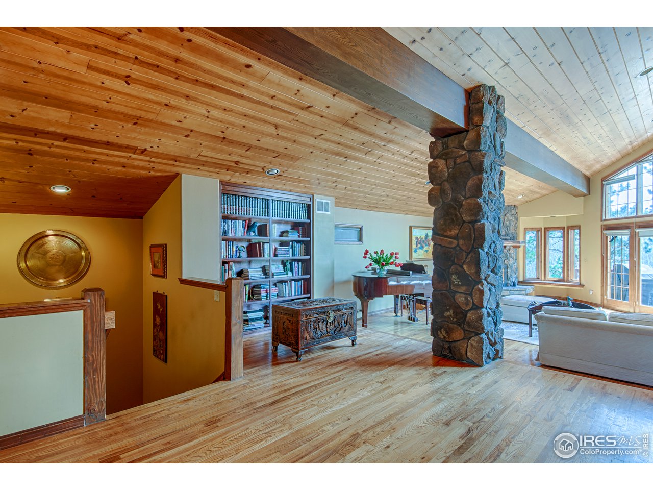 3464 Ridge Road Nederland, CO 80466 - Photo 6 of 35 a living room with furniture and a wooden floor