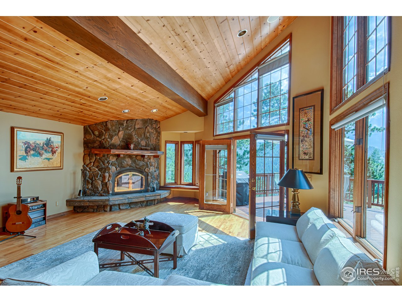3464 Ridge Road Nederland, CO 80466 - Photo 7 of 35 a living room with furniture a rug and a floor to ceiling window