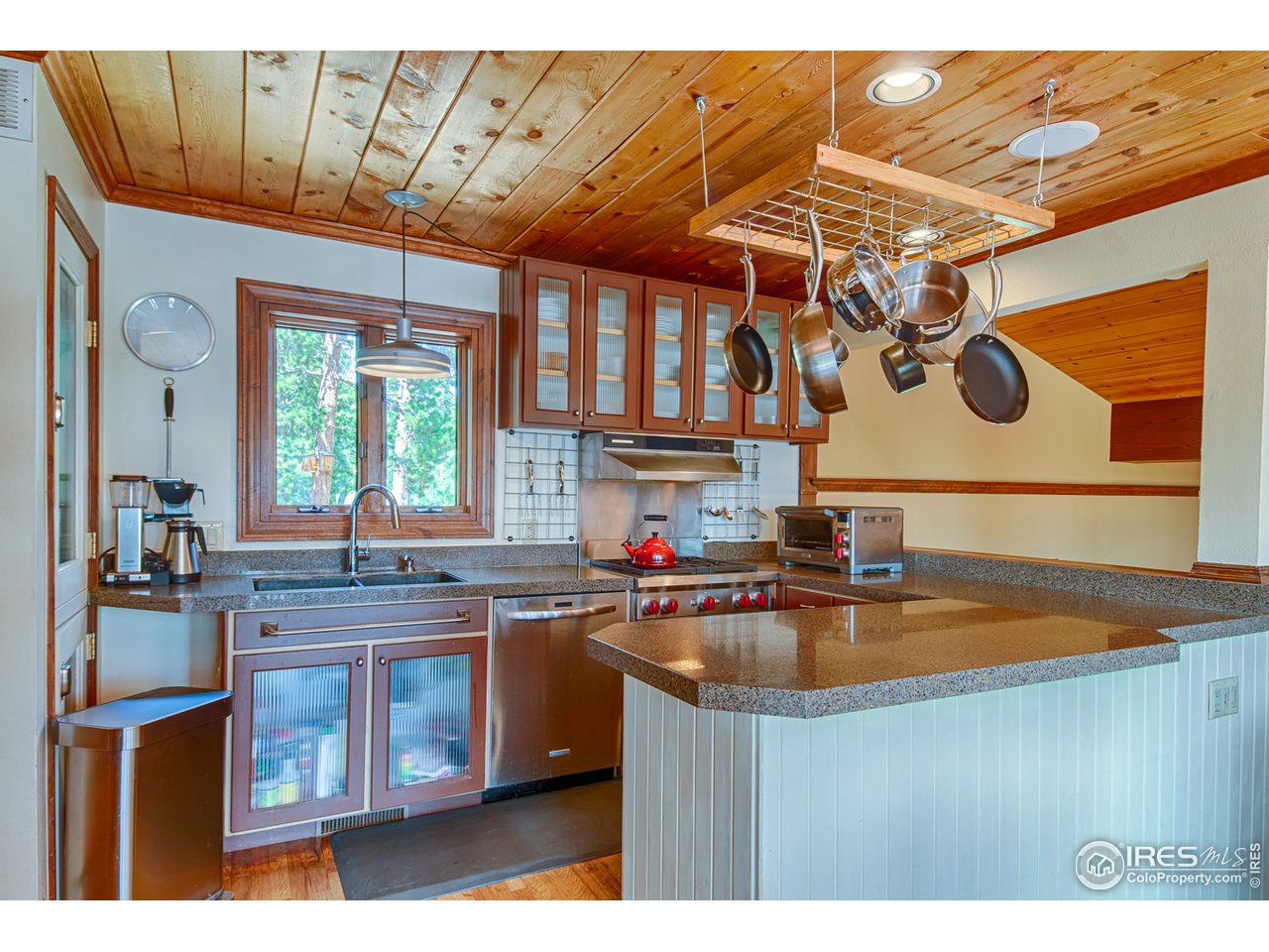 3464 Ridge Road Nederland, CO 80466 - Photo 8 of 35 a kitchen with a sink a stove and cabinets