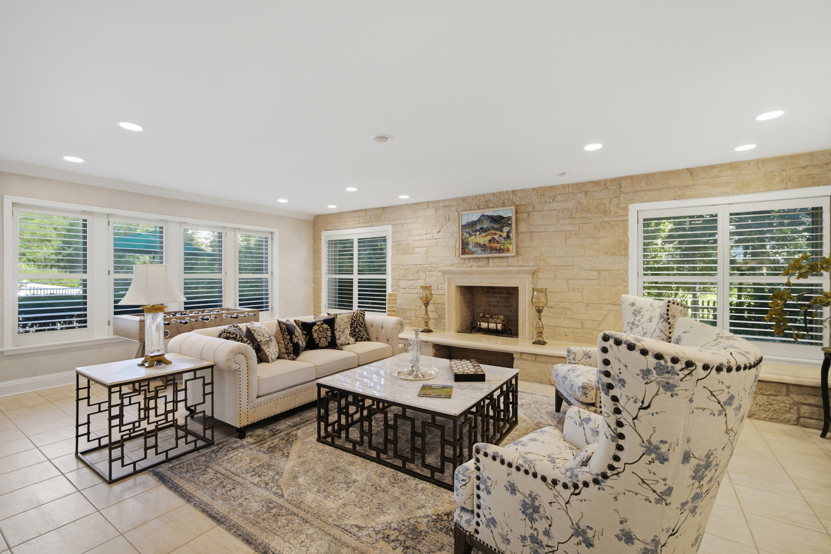 1601 Riverwoods Road Lincolnshire, IL 60045 - Photo 14 of 45 a living room with furniture large window and a fireplace