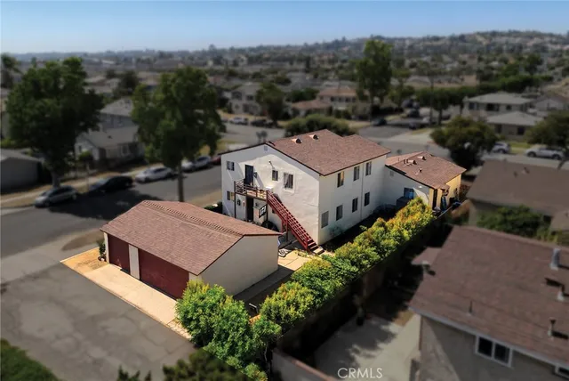 an aerial view of a house with a garden