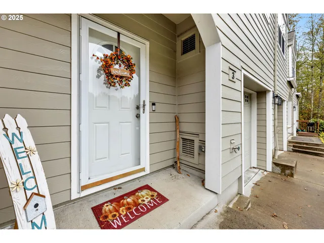 an entryway with a rug