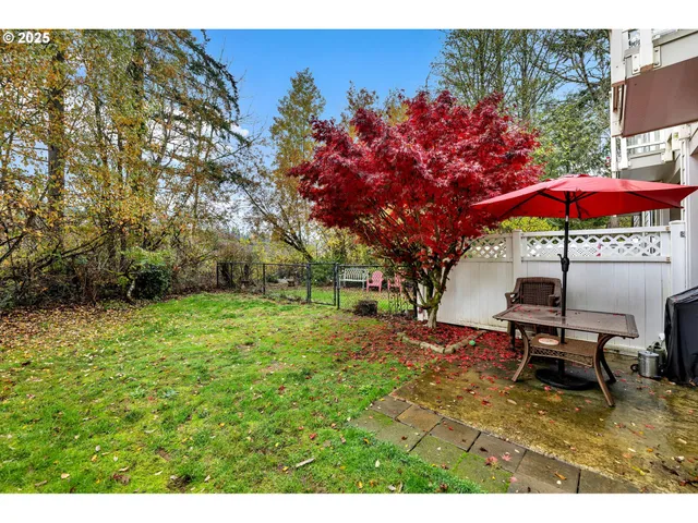a view of a backyard with sitting area