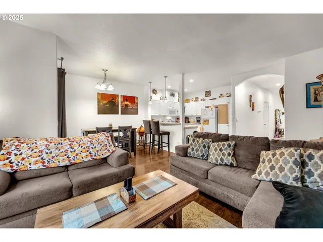 a living room with furniture and white walls