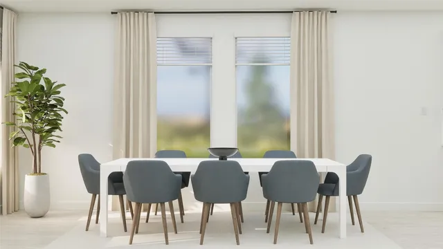 a view of a dining room with furniture and window