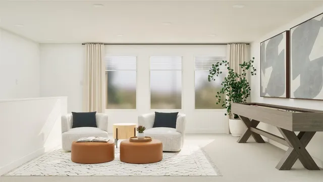 a living room with furniture and a potted plant