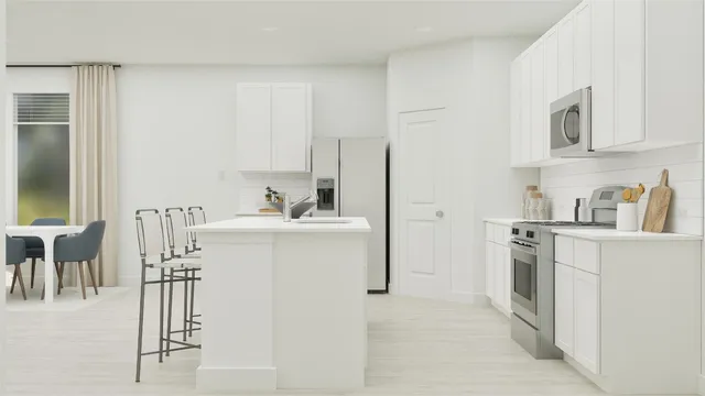a kitchen with a sink appliances and cabinets