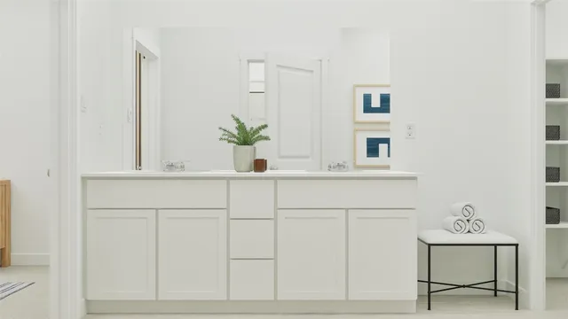 a bathroom with a sink and mirror