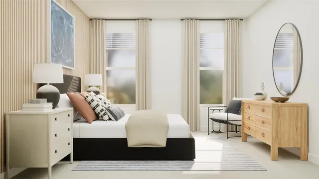 a living room with furniture and a mirror