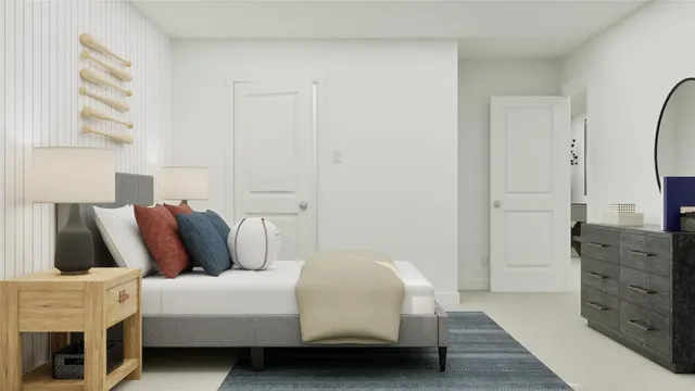 a bedroom with a bed and a flat tv screen