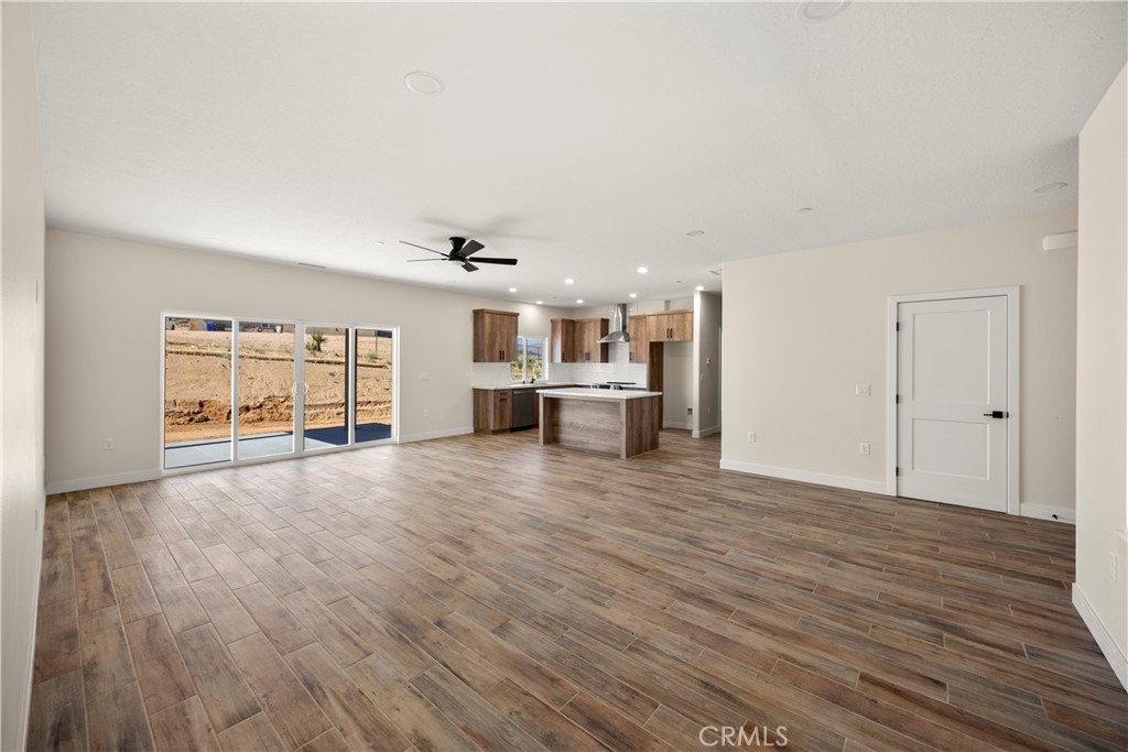 22324 Rancho Street Apple Valley, CA 92308 - Photo 13 of 47 a view of empty room with wooden floor