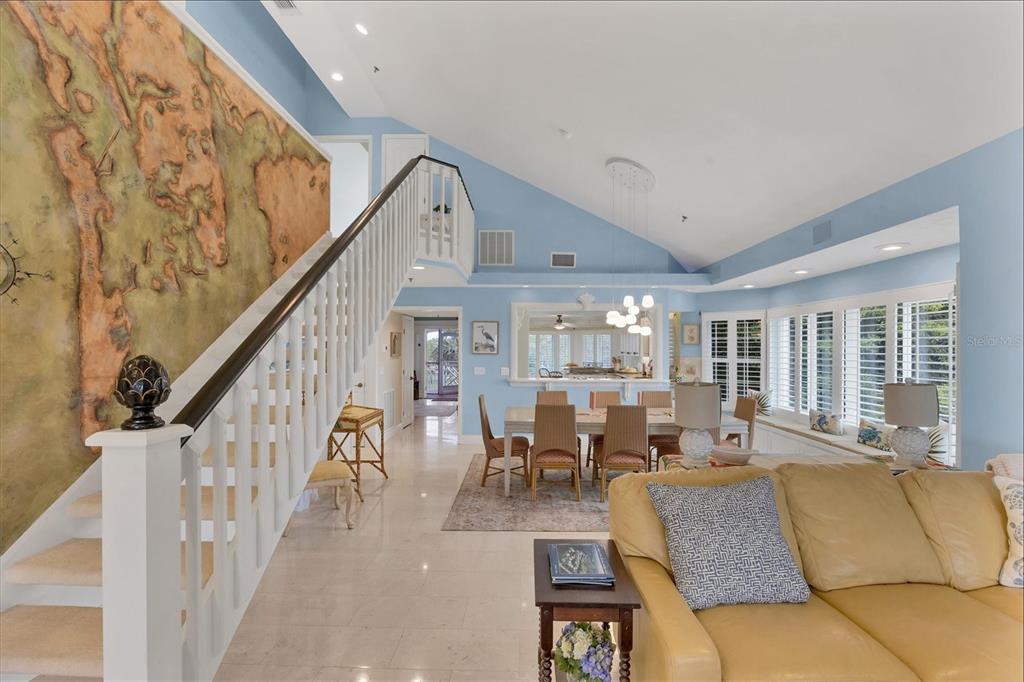 11000 Placida Road, Unit 2103 Placida, FL 33946 - Photo 13 of 63 a living room with furniture and floor to ceiling windows